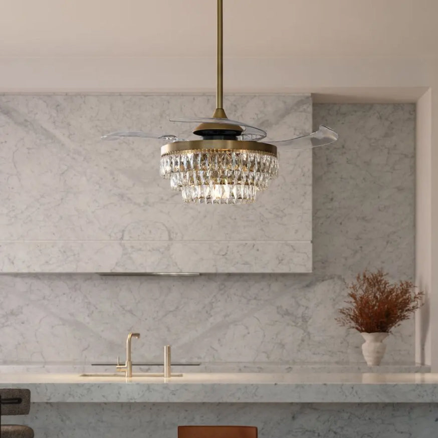 Fanaway ceiling fan with a brass crystal chandelier light above a marble kitchen benchtop